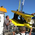 Unloading the Wave Glider too install the missing electronic box.