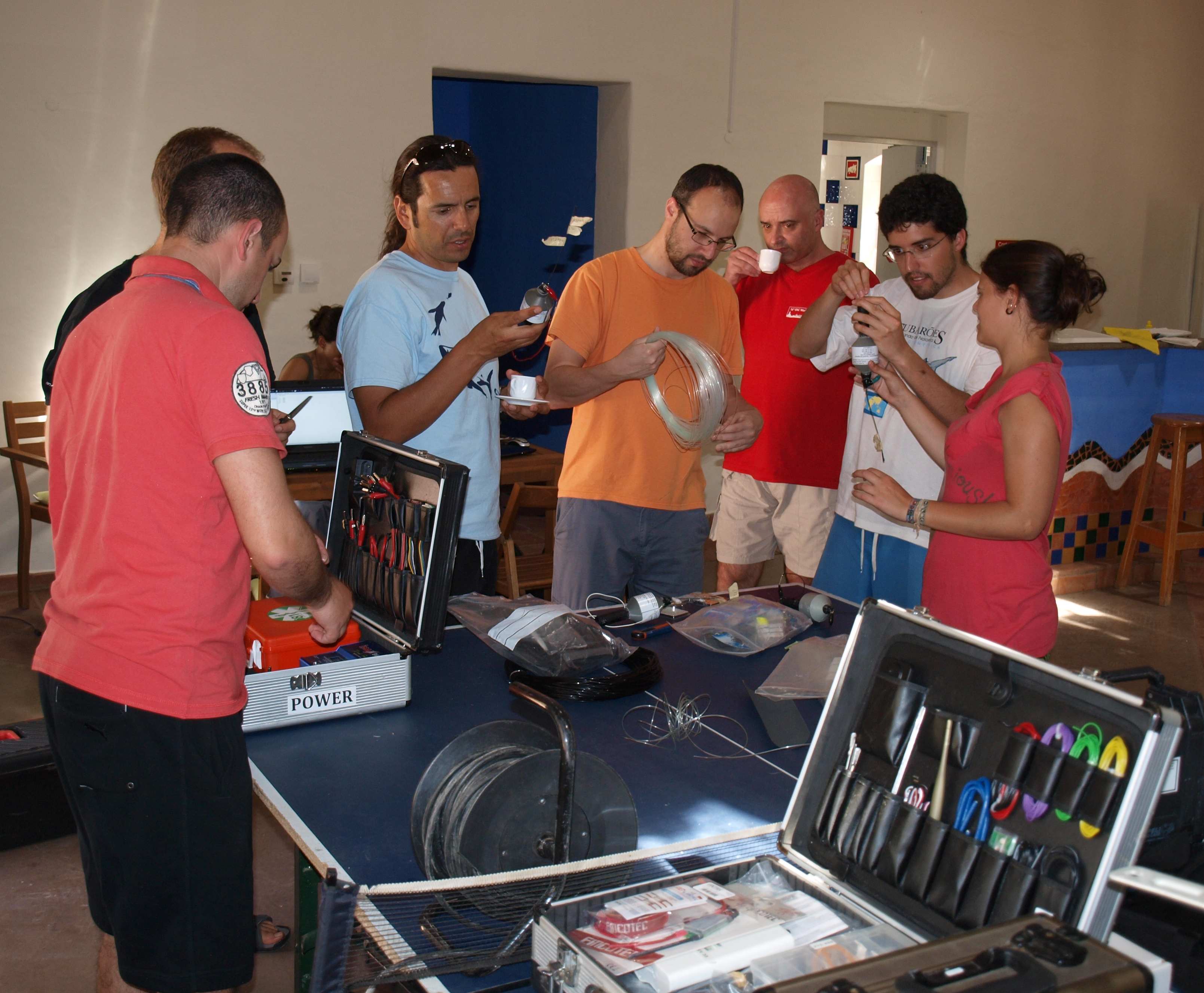 A working Sunday for all. People gathered around pitching in to build FEUP designed ARGOS tags with a tether. From left: Filipe, Renato, Jorge Fontes, Nuno, João, Fortuna and Ana Couto.