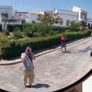 Wandering in lovely Tavira. Francisco and Fortuna at a road reflector.