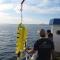 The underwater glider of the WaveGlider being recovered at the end of the day on the R/V Diplodus.
